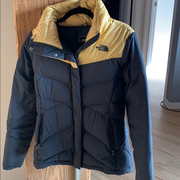 north face black and gold jacket